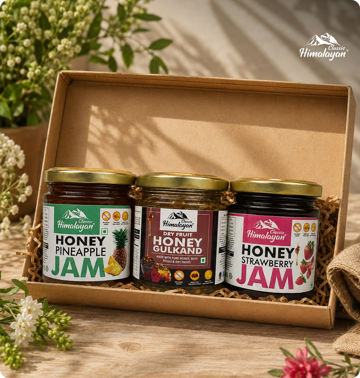 A gift box containing three jars of Himalayan honey: Honey Pineapple Jam, Honey Gulkand, and Honey Strawberry Jam.