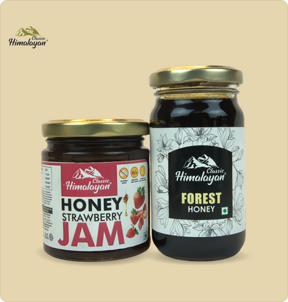 Two glass jars of Classic Himalayan honey products on a solid beige background: a smaller jar of Honey Strawberry Jam and a larger jar of Forest Honey.