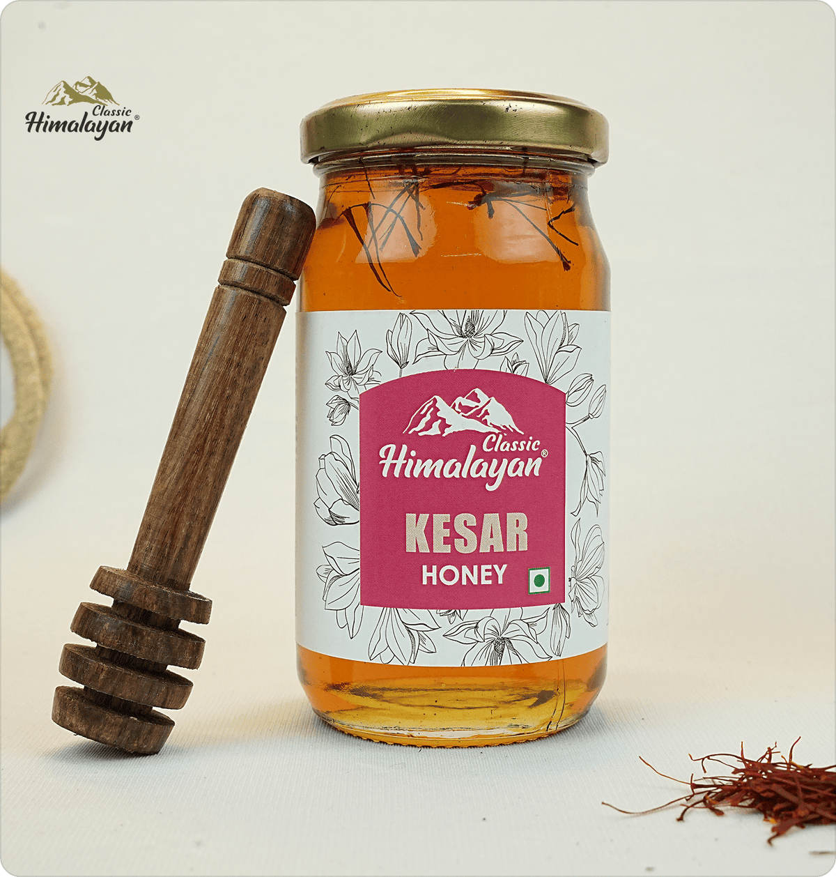 Classic Himalayan Kesar Honey with saffron threads and dipper