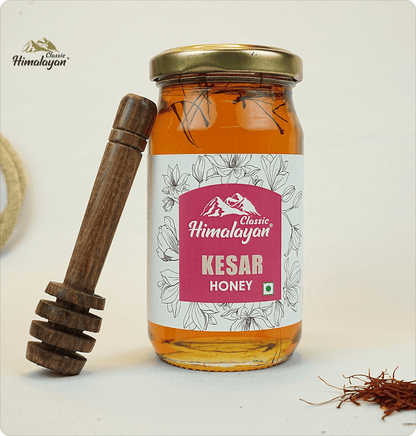 Classic Himalayan Kesar Honey with saffron threads and dipper