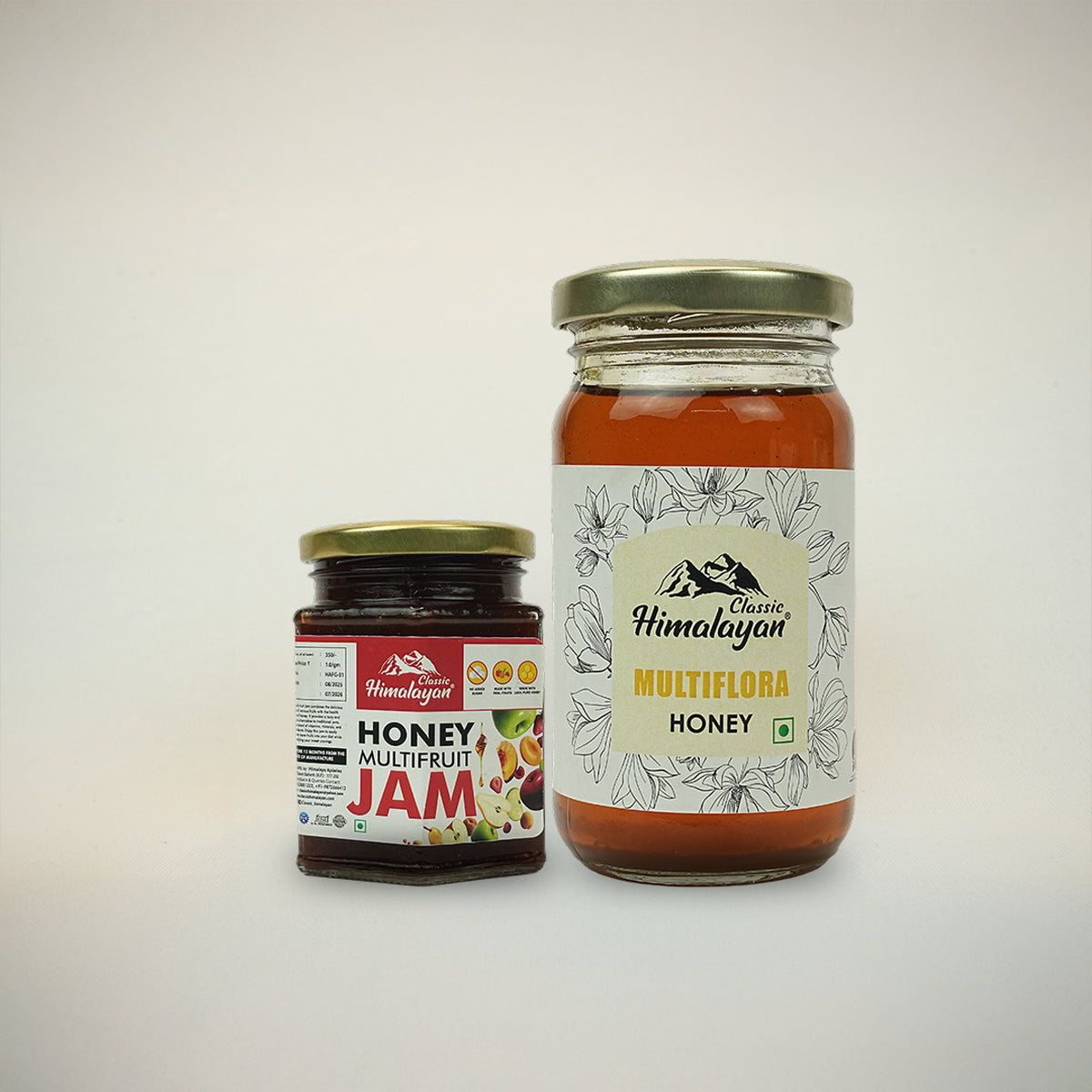 Two jars of honey and jam from Classic Himalayan on a white background
